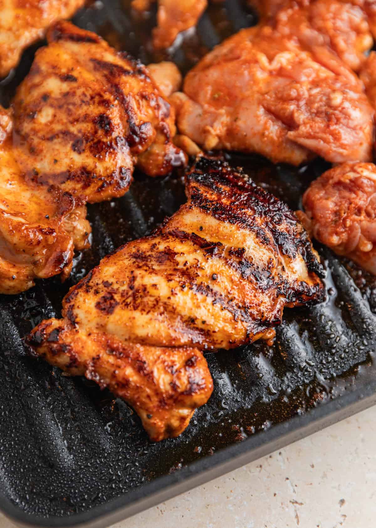 Chicken on grill pan after flipped.