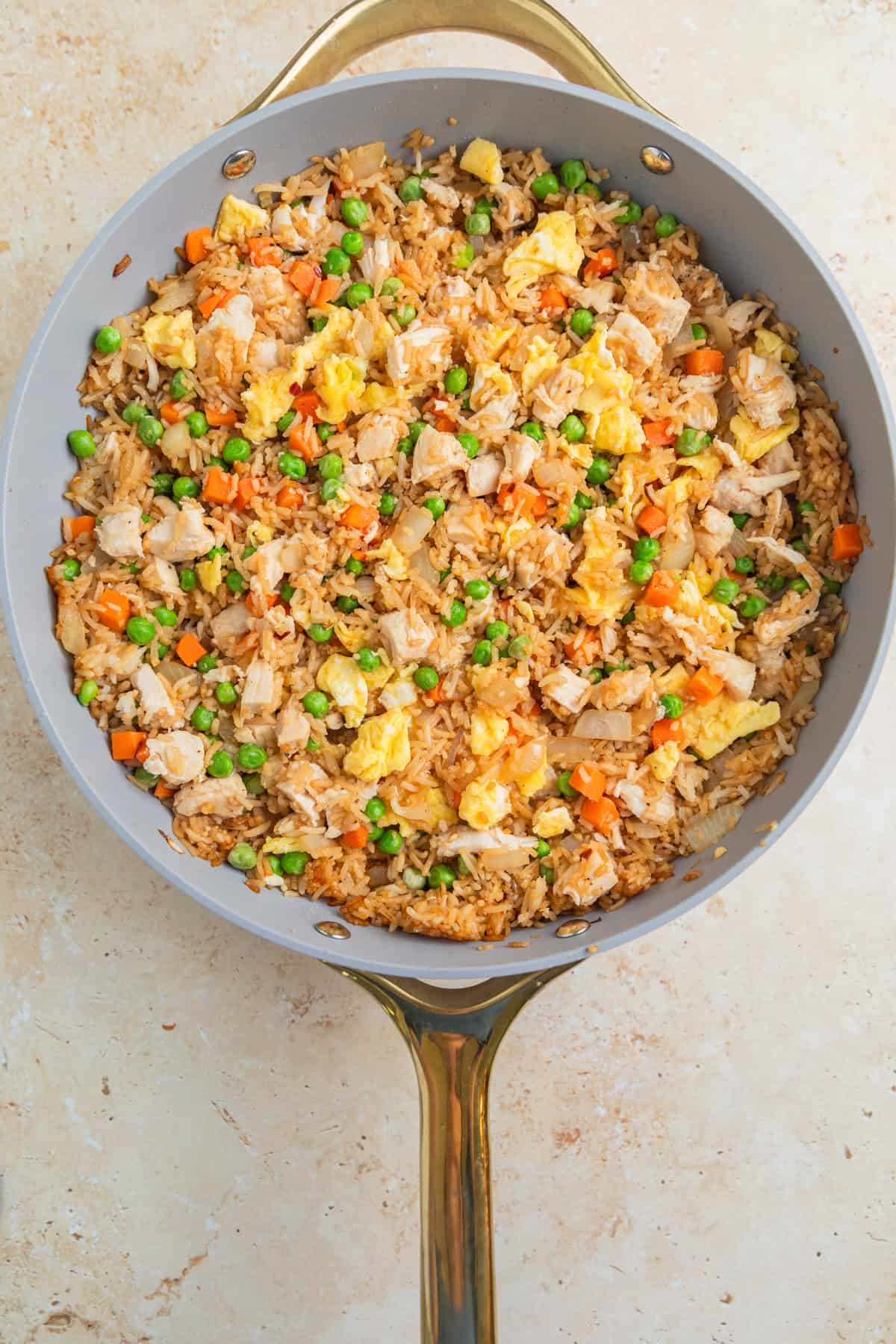 Chicken fried rice in large skillet.