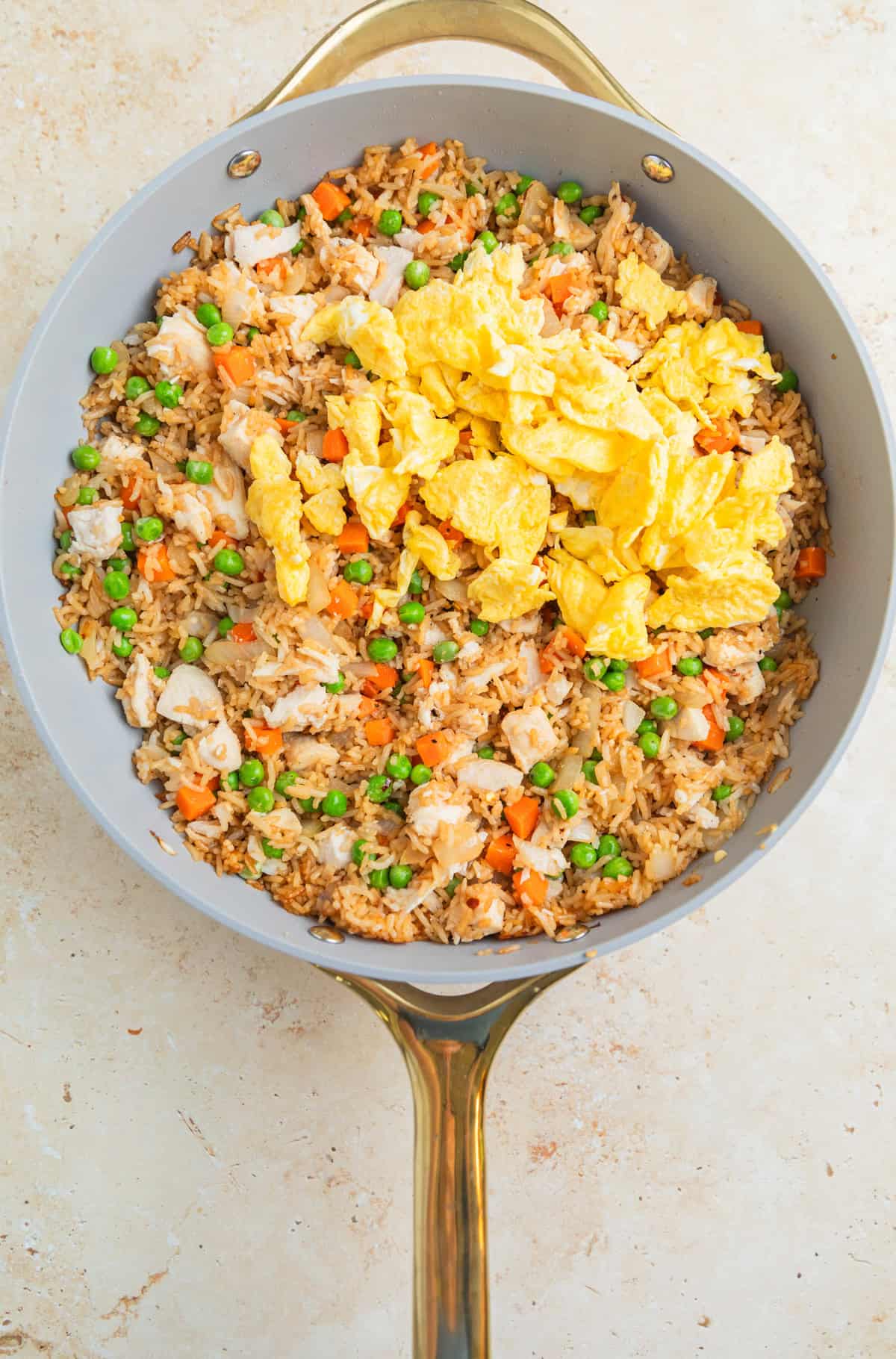 Skillet with easy chicken fried rice and scrambled eggs added back in.