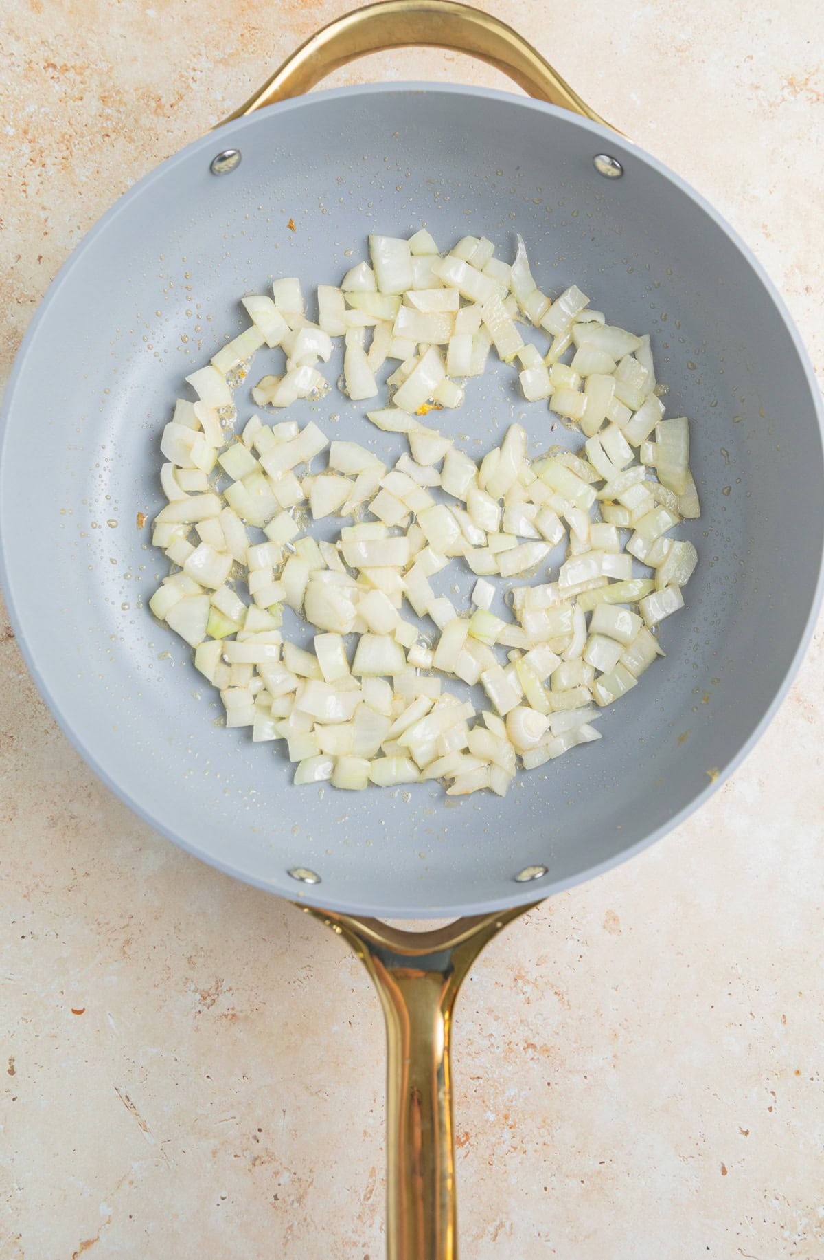 Onions sautéed in large skillet.