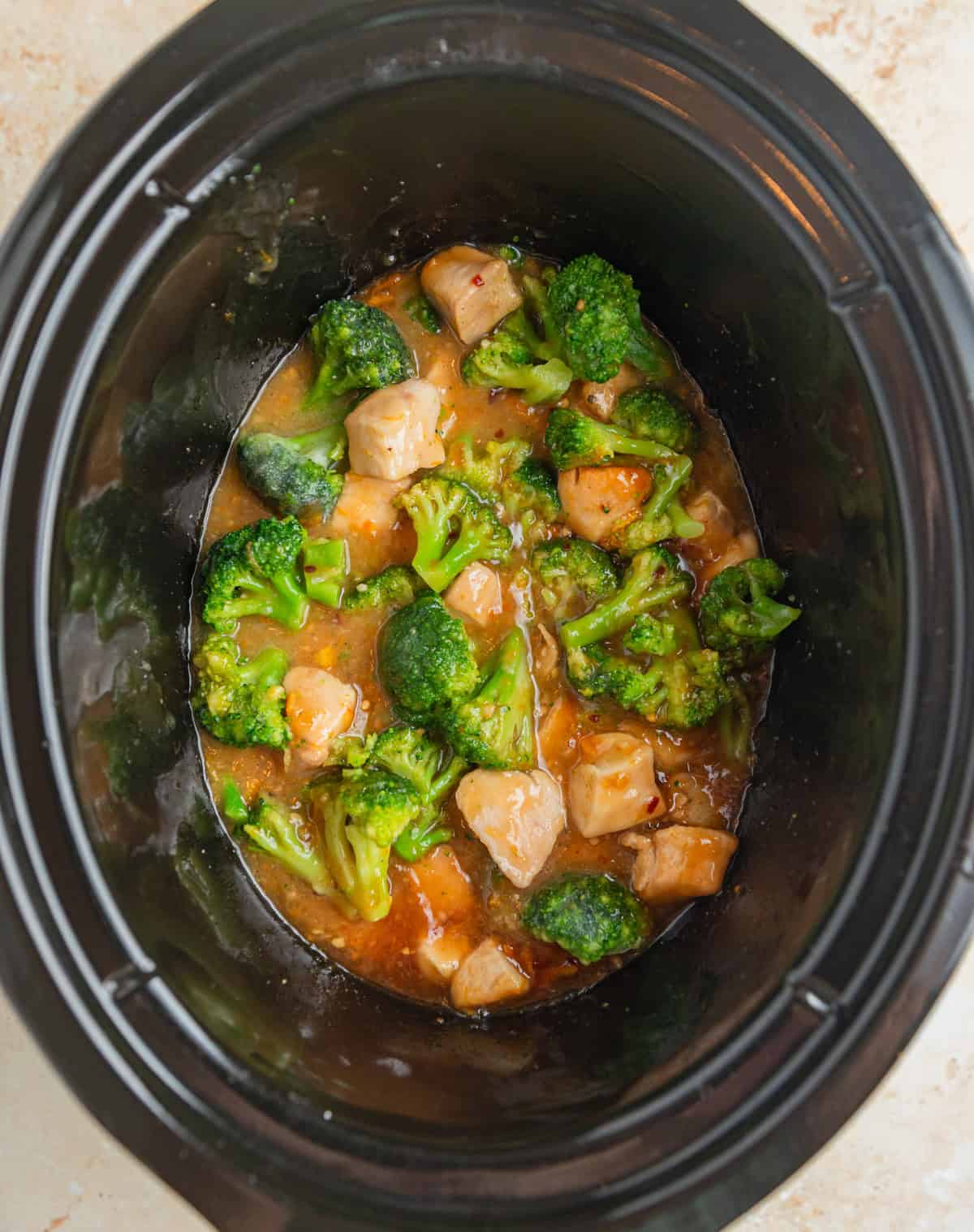 Frozen broccoli added to chicken in crock pot.