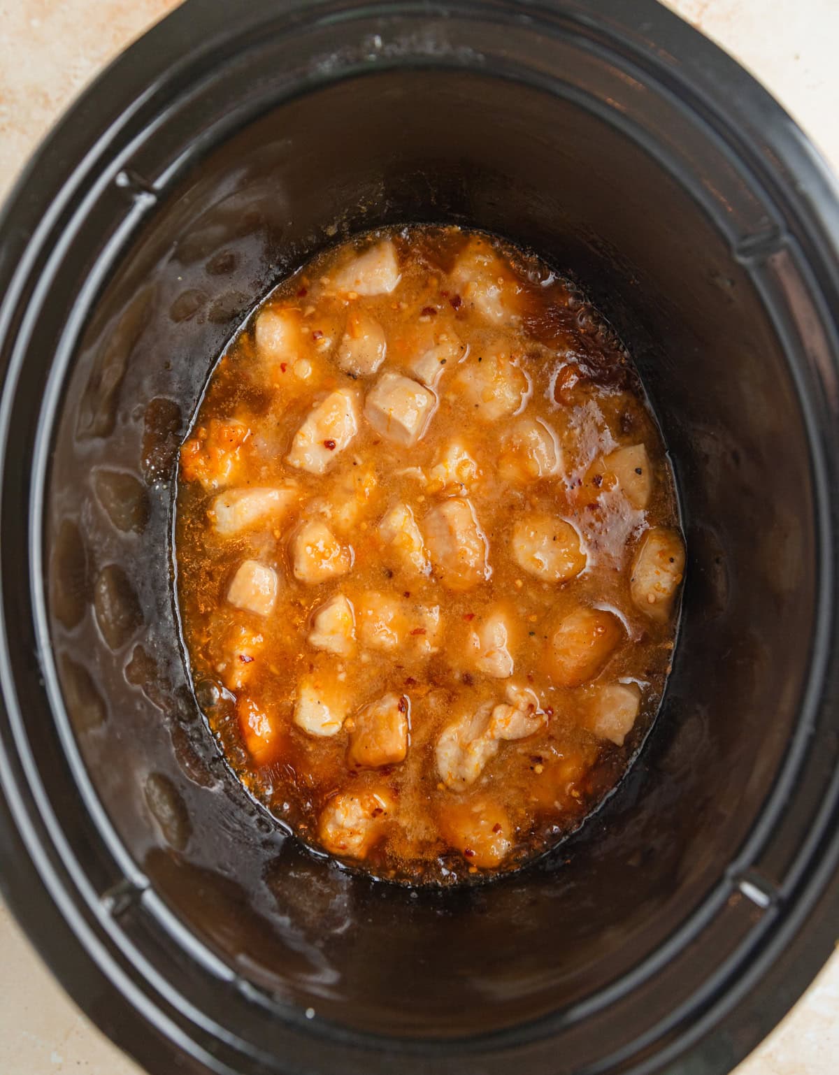 Cooked orange chicken in crock pot.