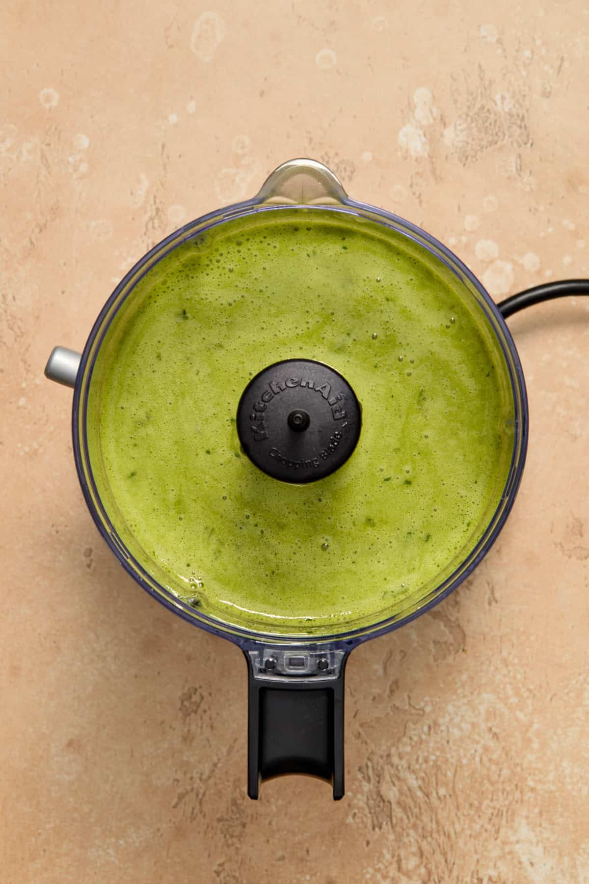 Cilantro lime dressing in food processor.