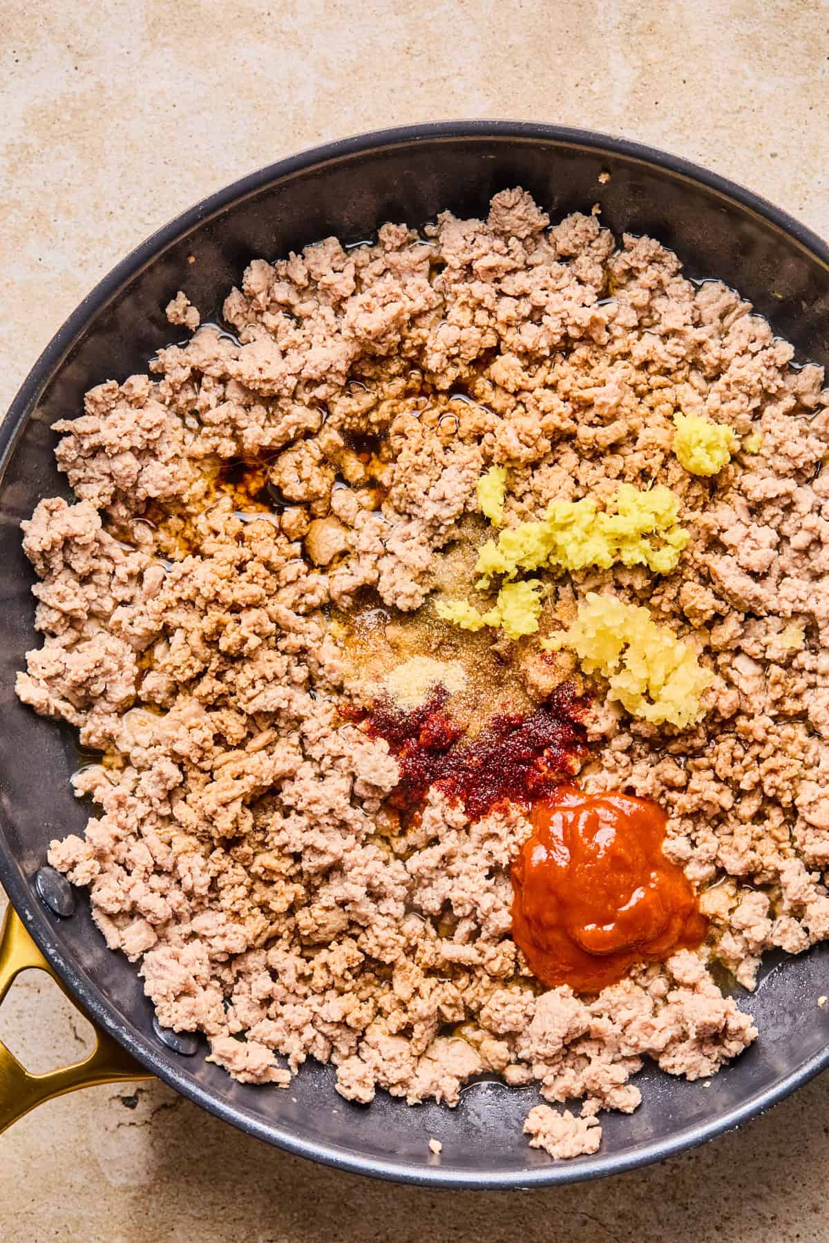 Seasoning added to ground turkey browned in skillet.