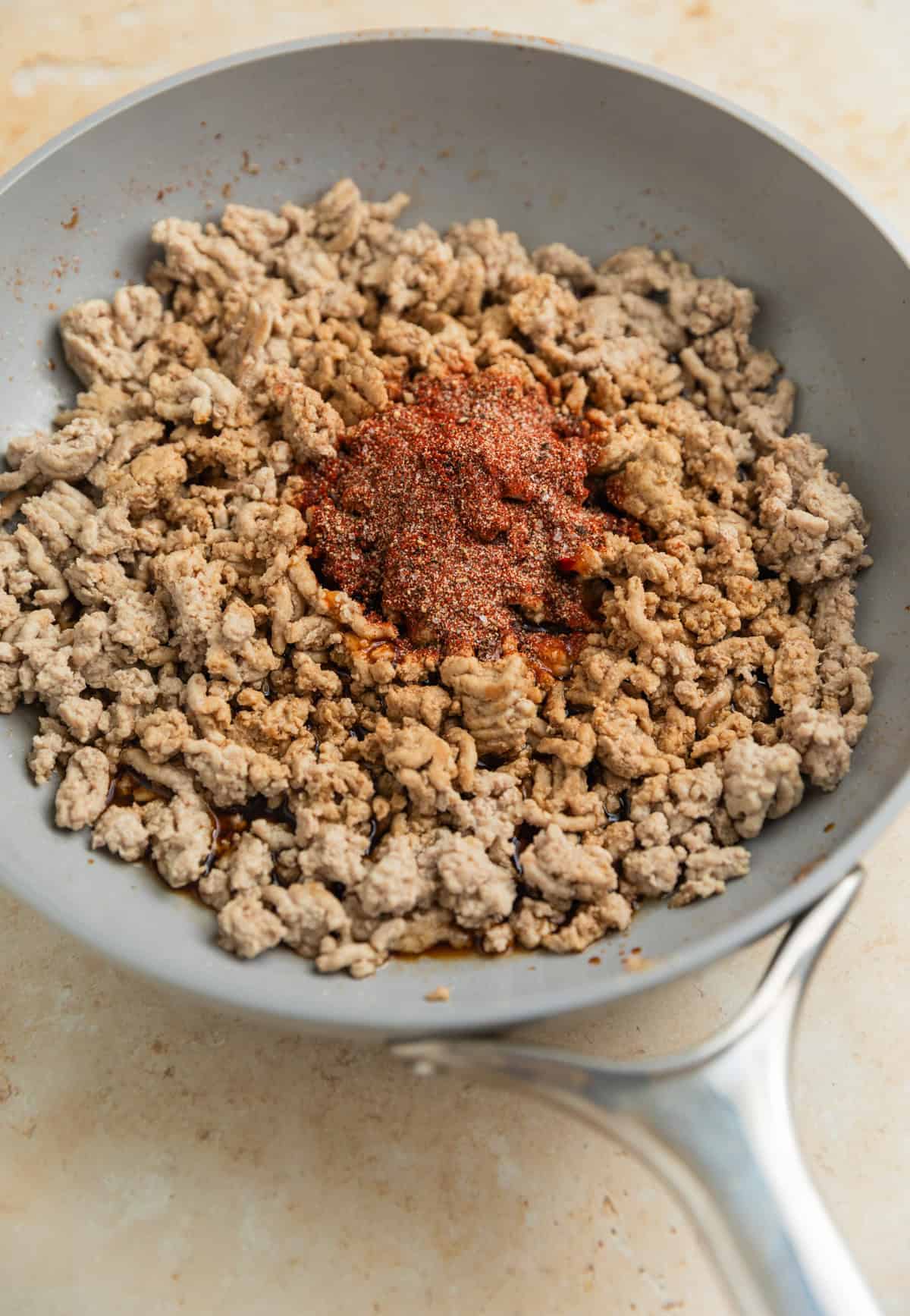 Seasoning added to ground turkey browned in skillet.