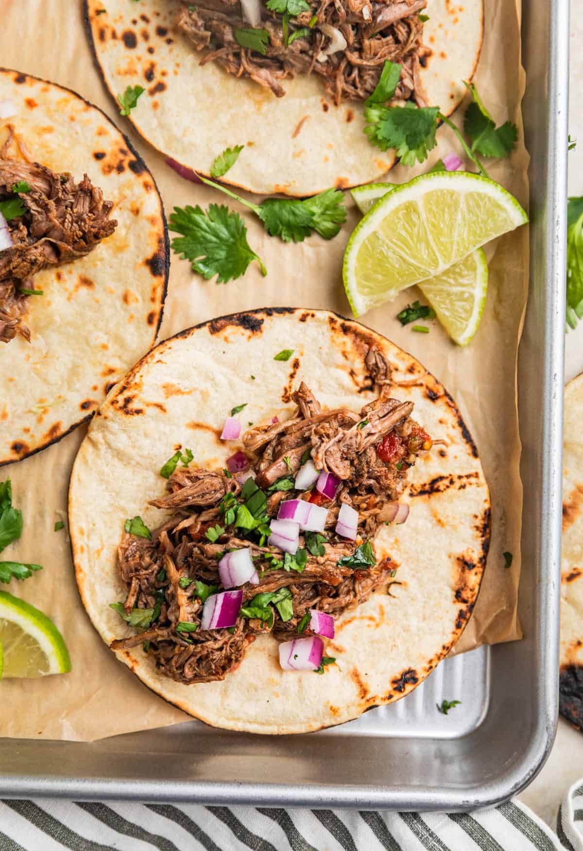 Overhead view of beef tacos on tray.