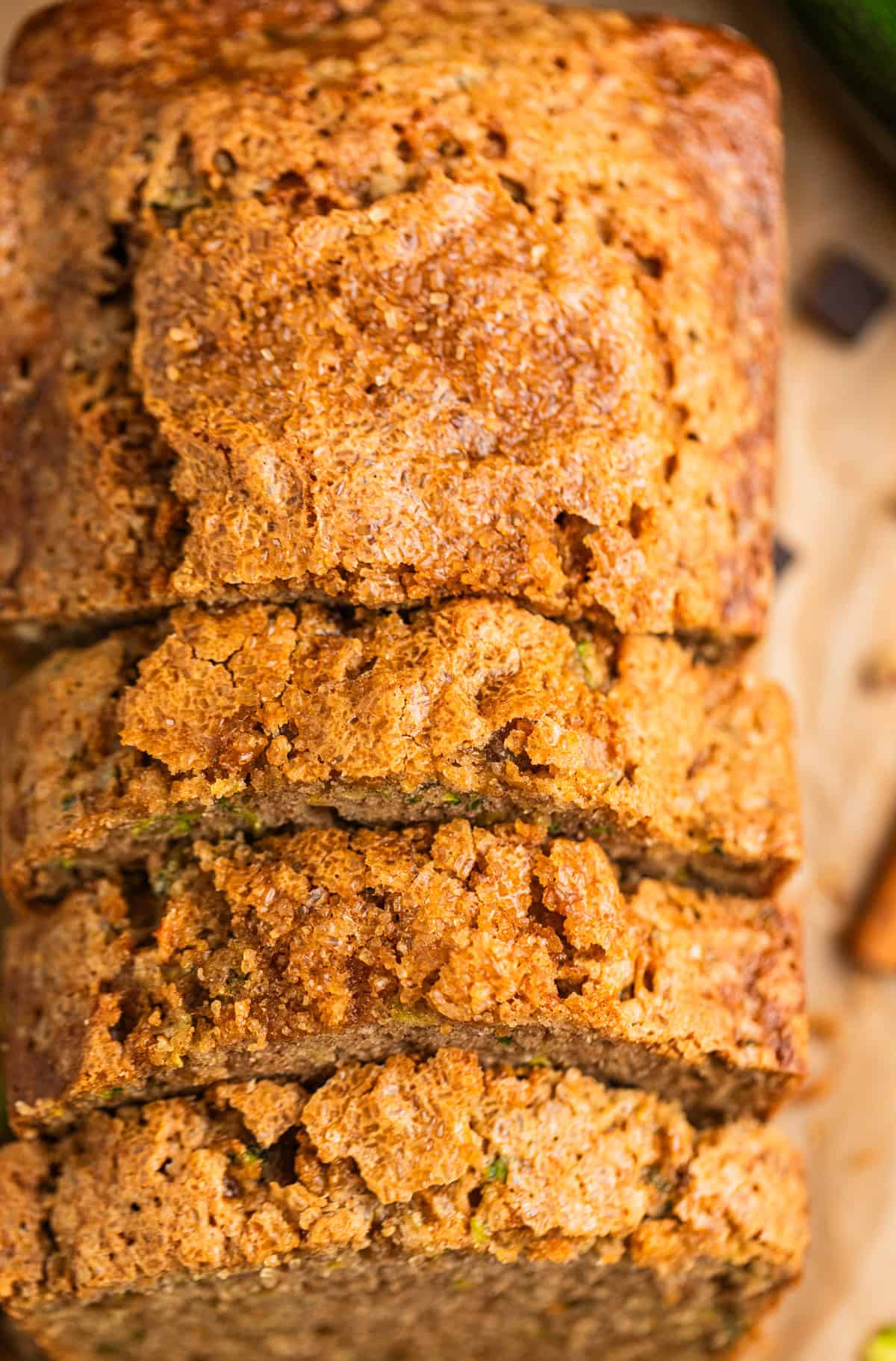 Slices of zucchini bread arranged on parchment.