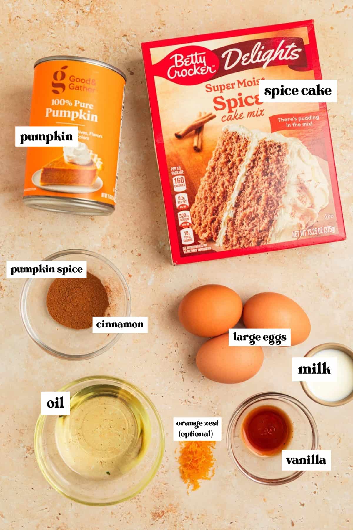 Can of pumpkin, spice cake mix box, oil, eggs and other ingredients for recipe.
