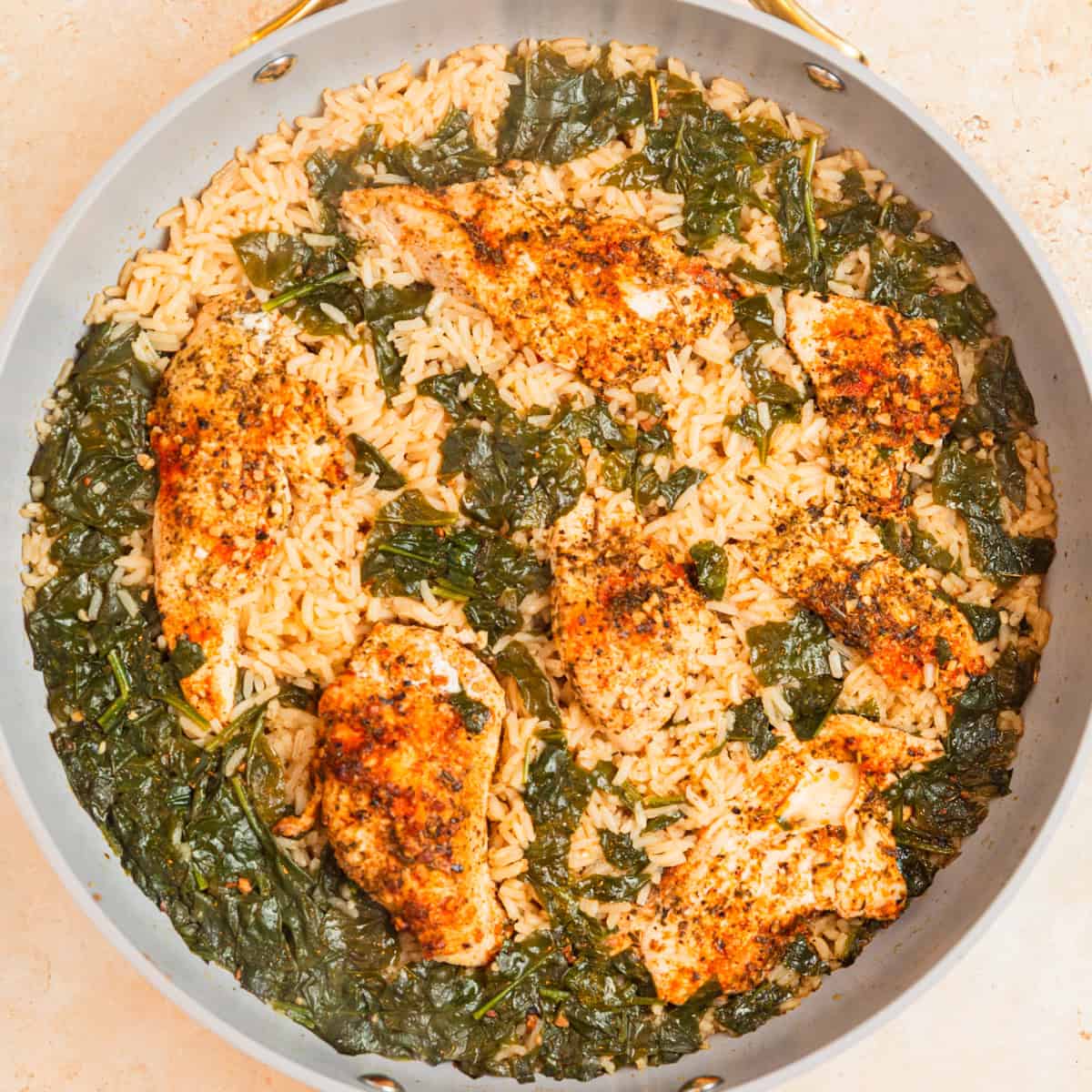 One pan chicken and rice prepared in skillet.