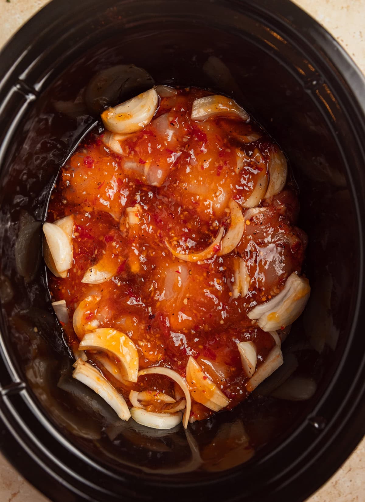 Apricot chicken in crockpot before cooking.