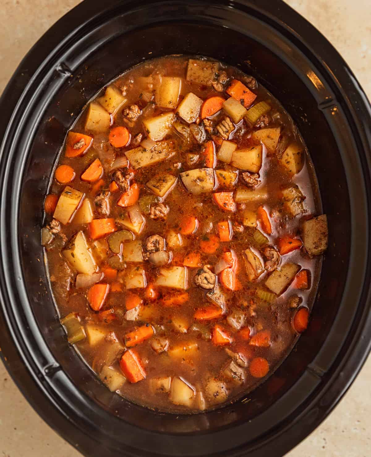 Crockpot cheeseburger soup in crockpot before adding cheese.