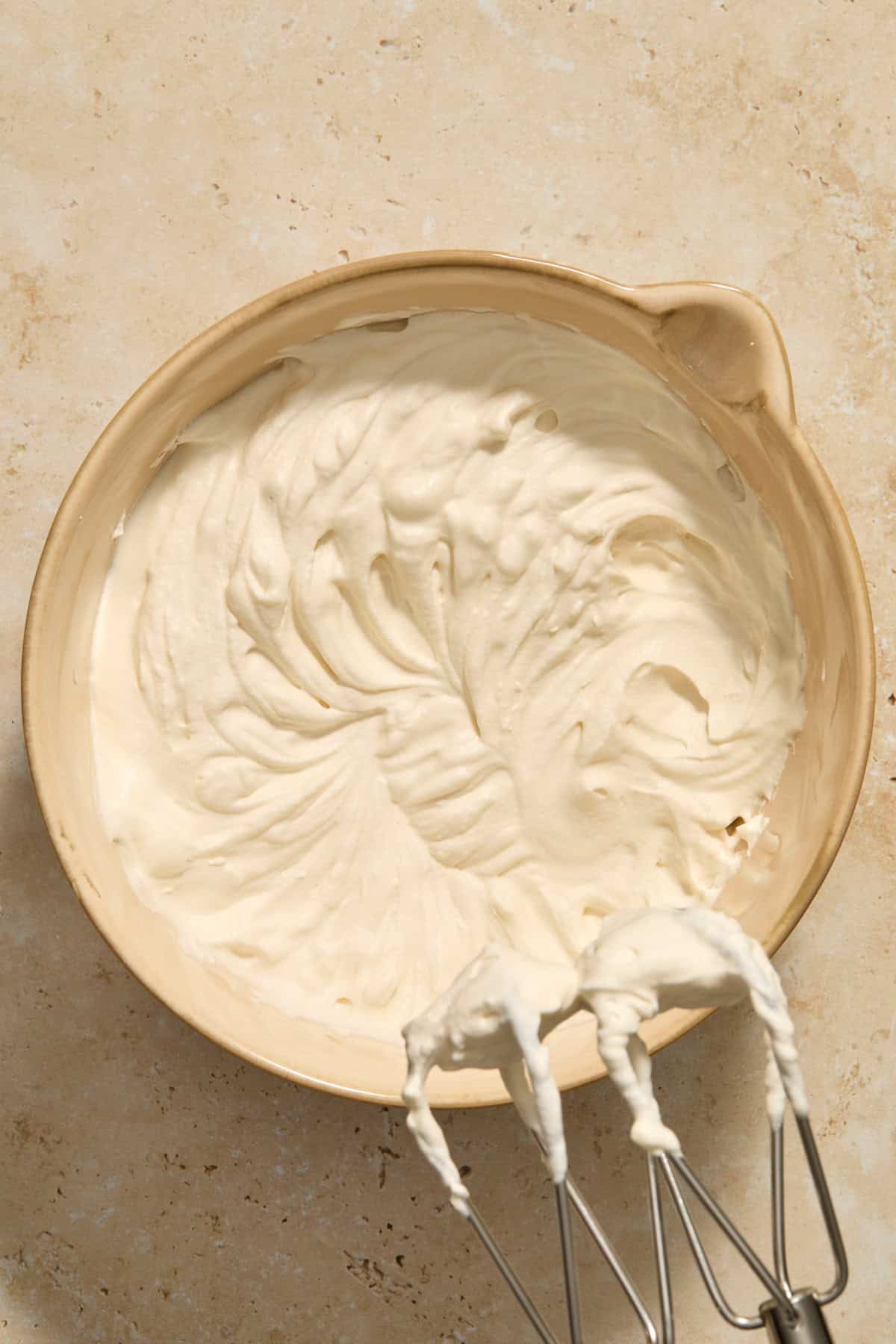 Brown sugar whipped cream in bowl.