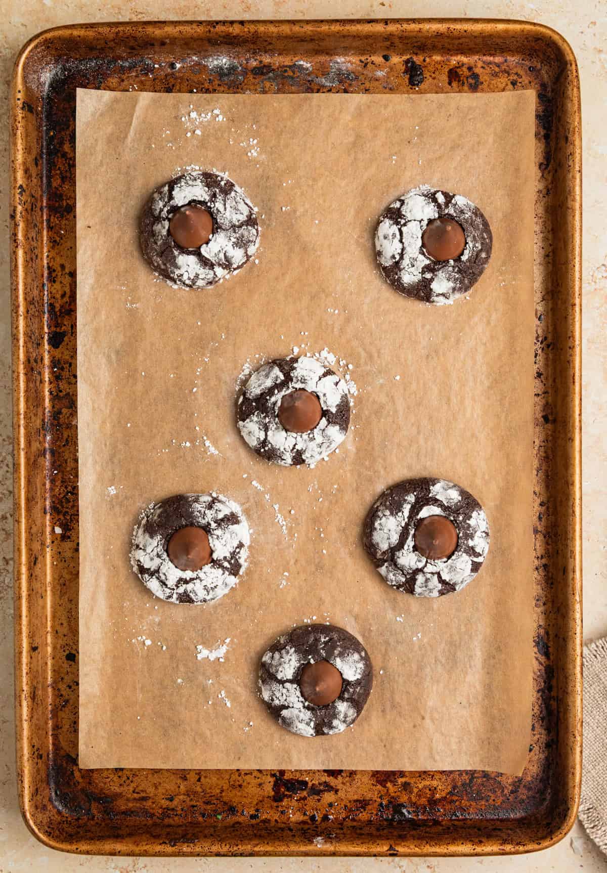 Chocolate blossom cookies on sheet pan.