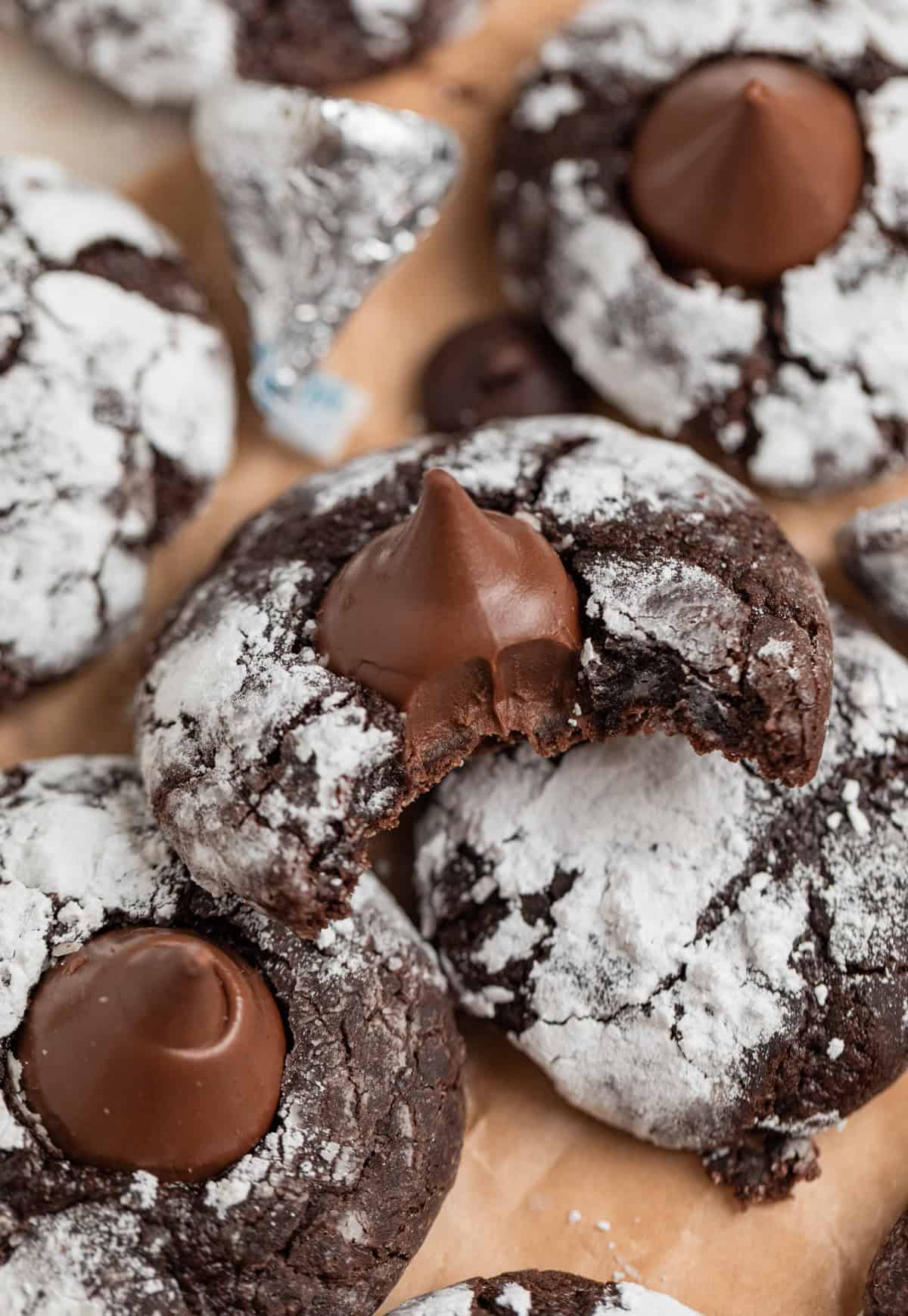 Chocolate blossom cookies with bite taken out of one cookie.
