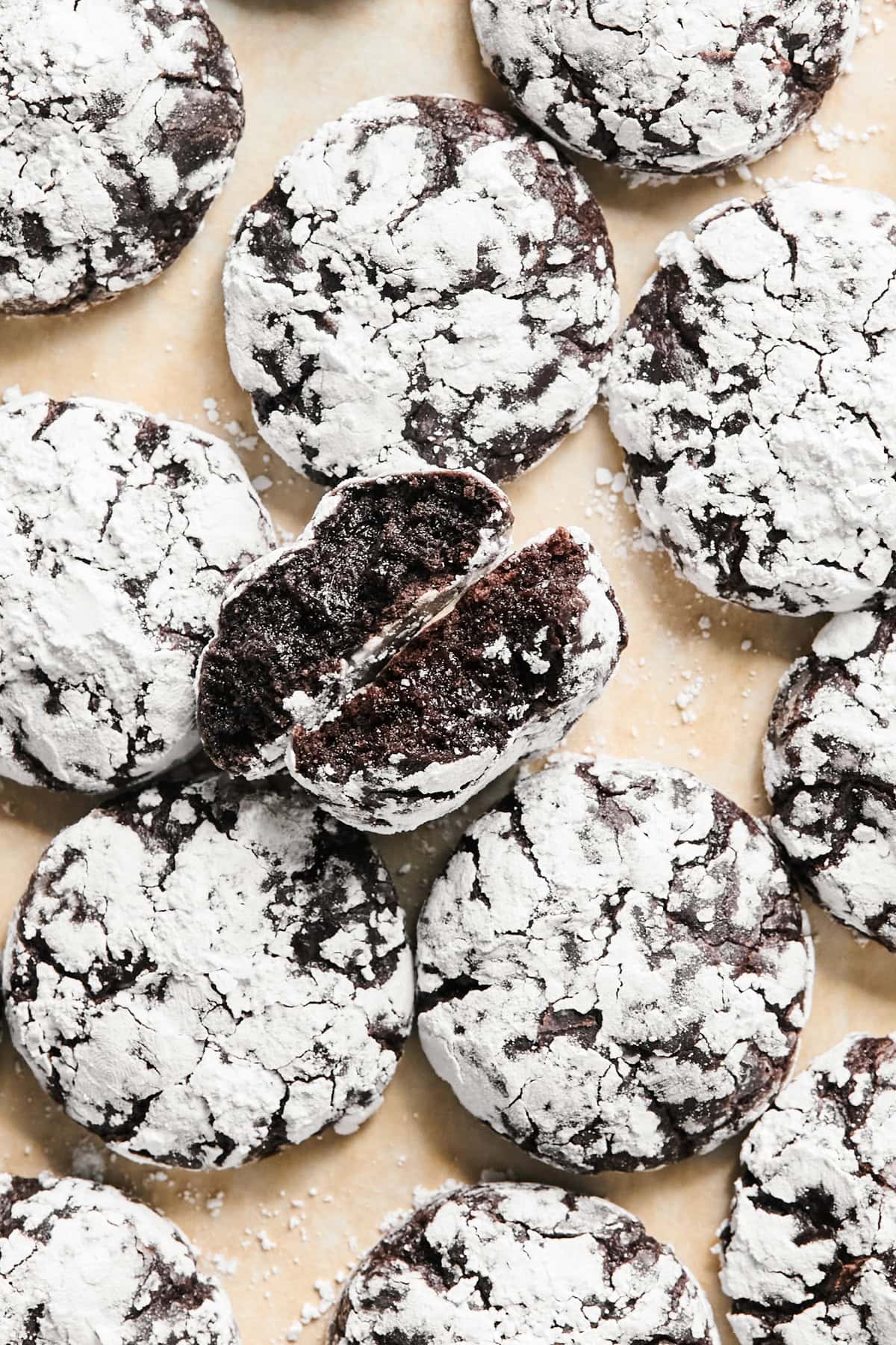 Chocolate crinkle cookies on surface.