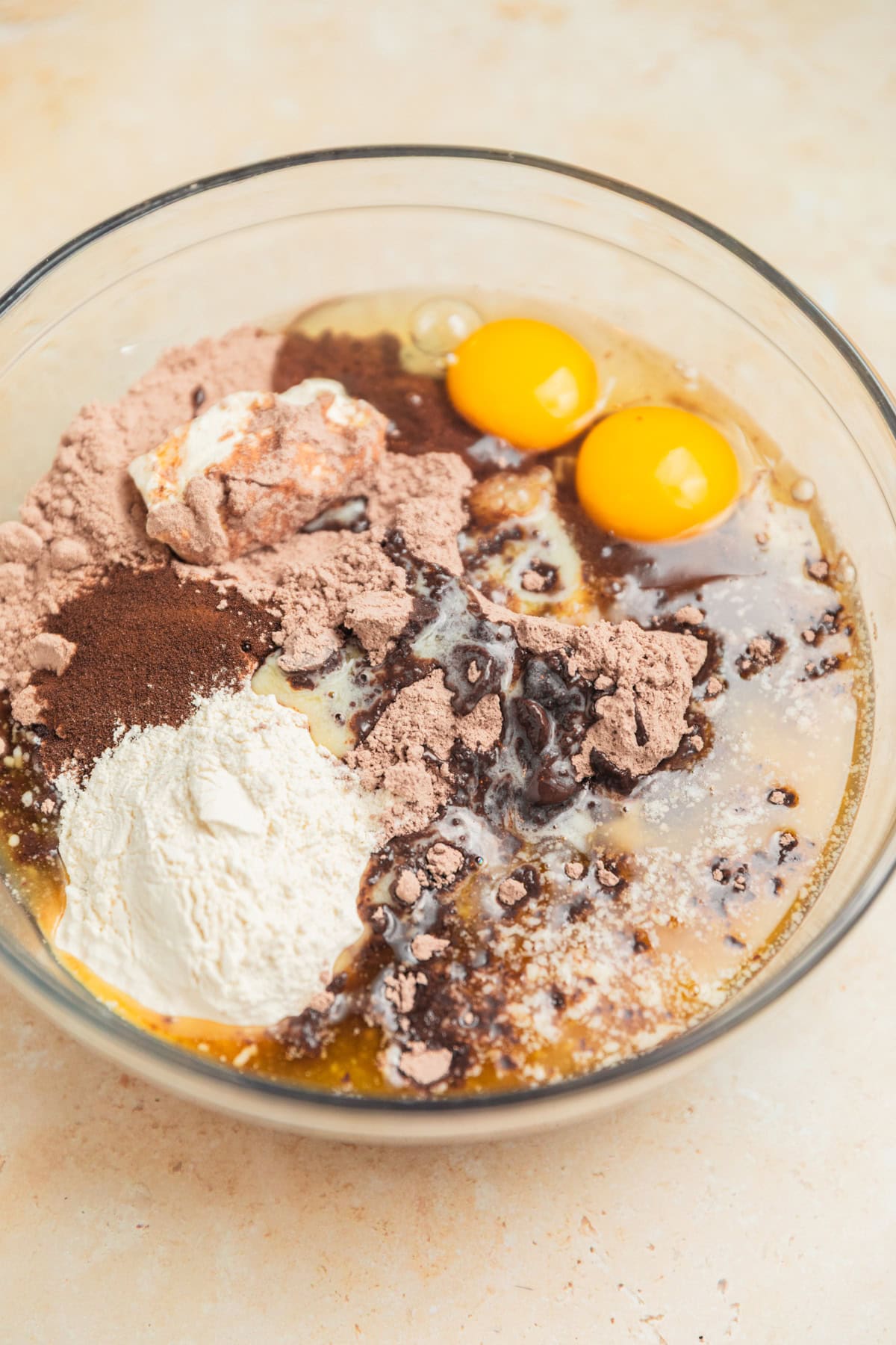 Brownie mix, eggs, flour, butter and other ingredients in mixing bowl.