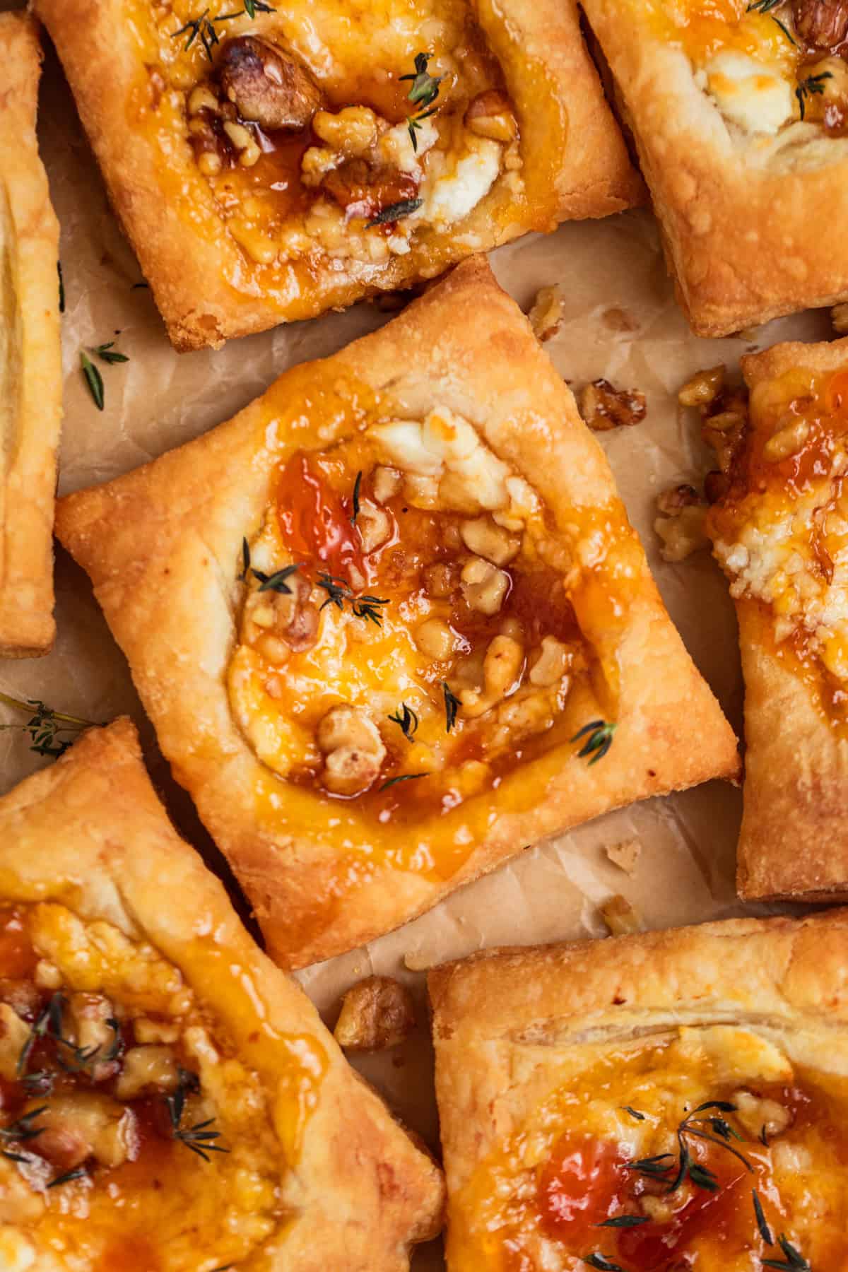 Goat cheese puff pastry squares topped with apricot jam and thyme.