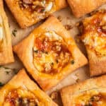 Puff pastry squares with goat cheese and apricot jam.