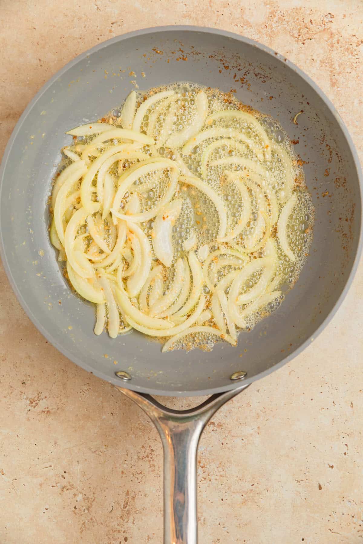 Softened onions and butter with garlic in skillet.