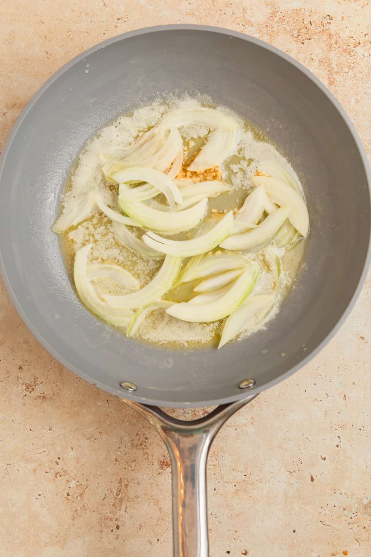 Onions and butter with garlic in skillet.