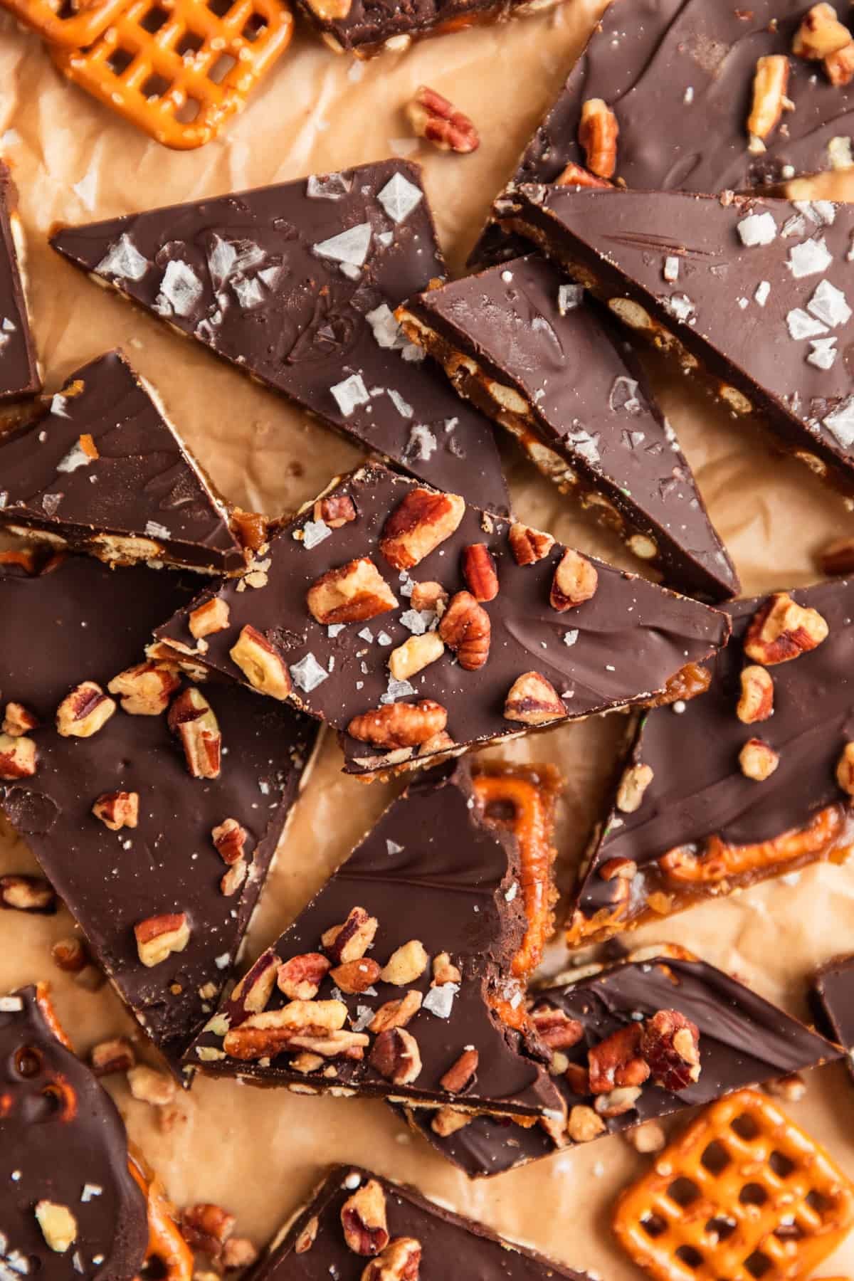 Pretzel toffee pieces with chopped pecans and sea salt over top.