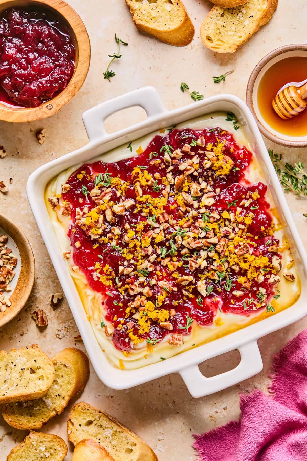 Whipped ricotta dip topped with cranberry sauce, honey, pecans, orange zest and thyme.