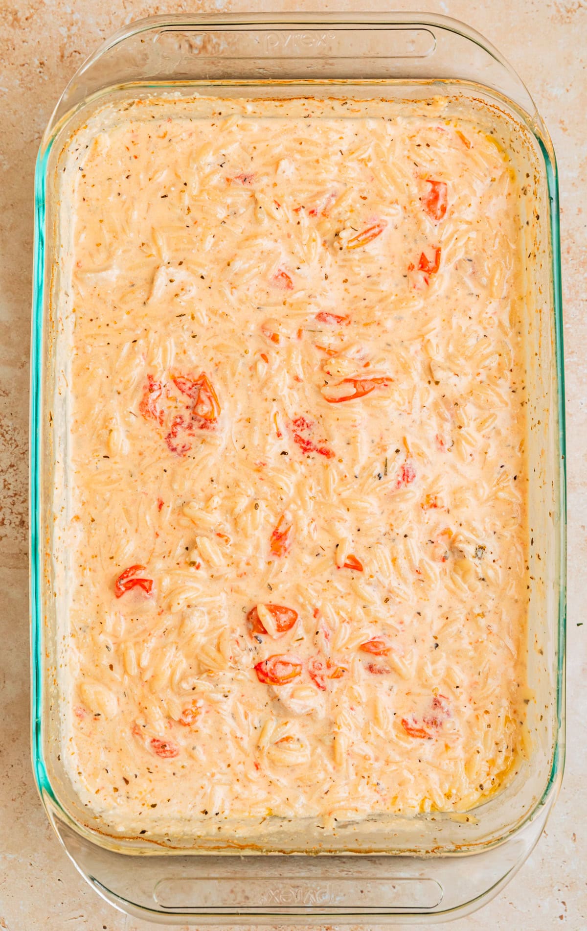 Stirred baked chicken and orzo.