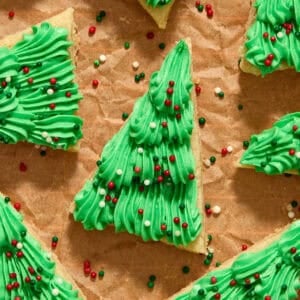 Frosted Christmas tree sugar cookie bars with red, green and white sprinkles.