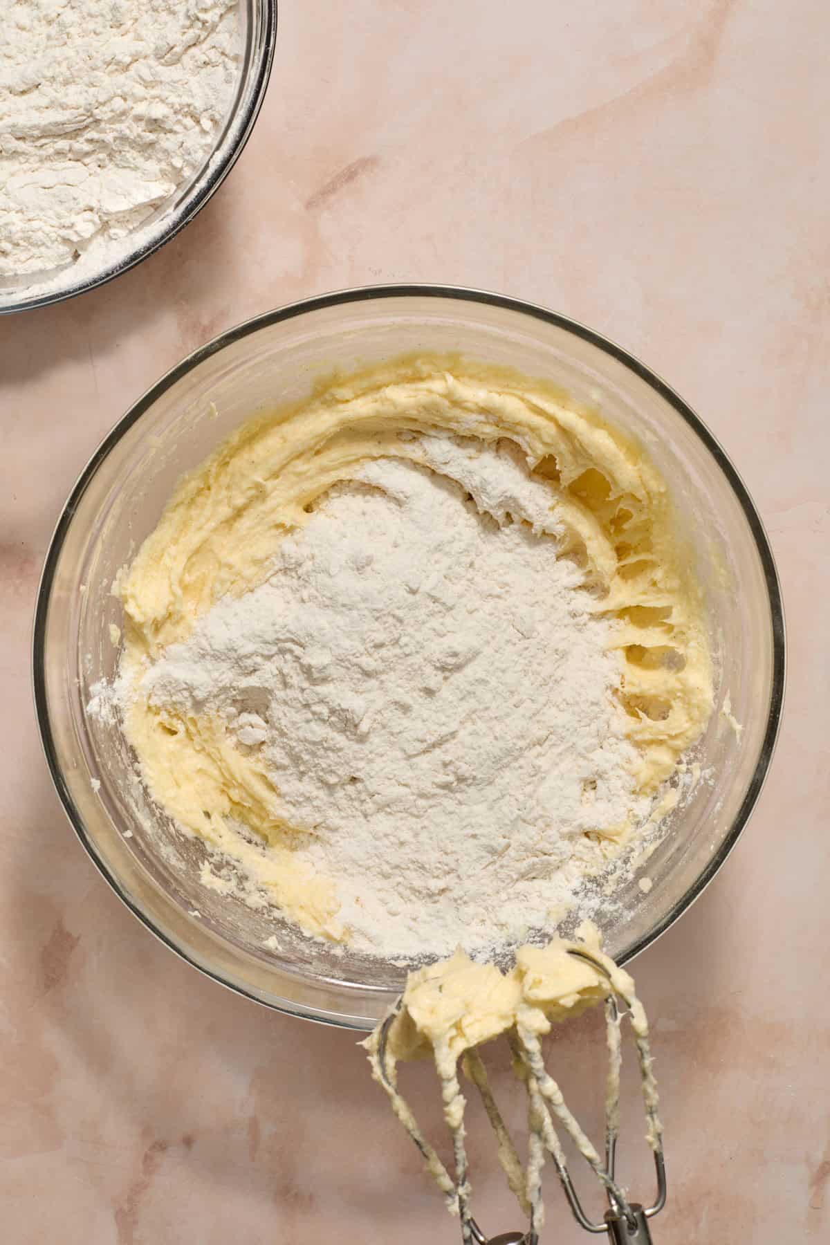 Dry ingredients added to wet ingredients in mixing bowl.