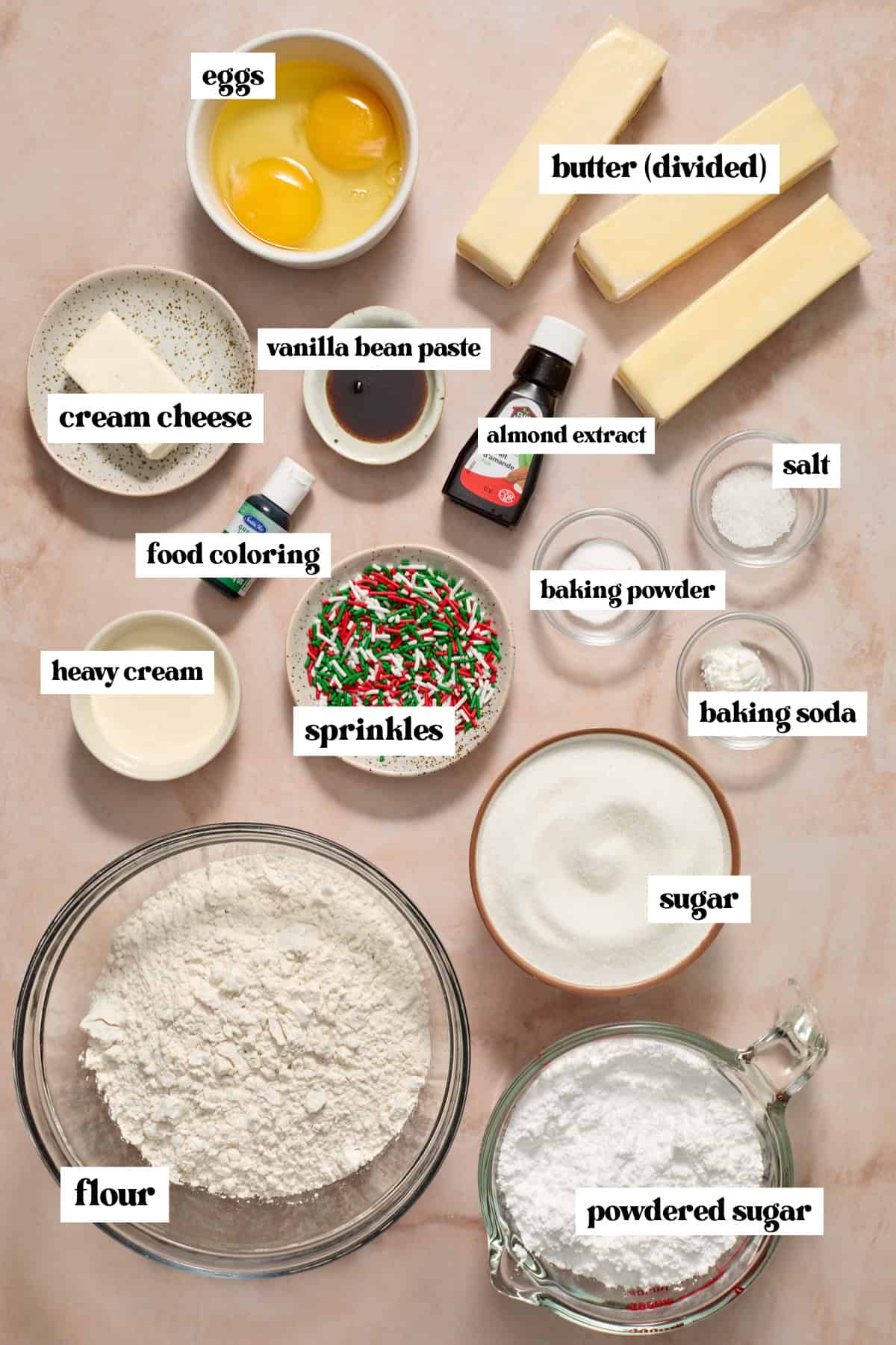 Butter, sugar, flour and other ingredients arranged on surface.