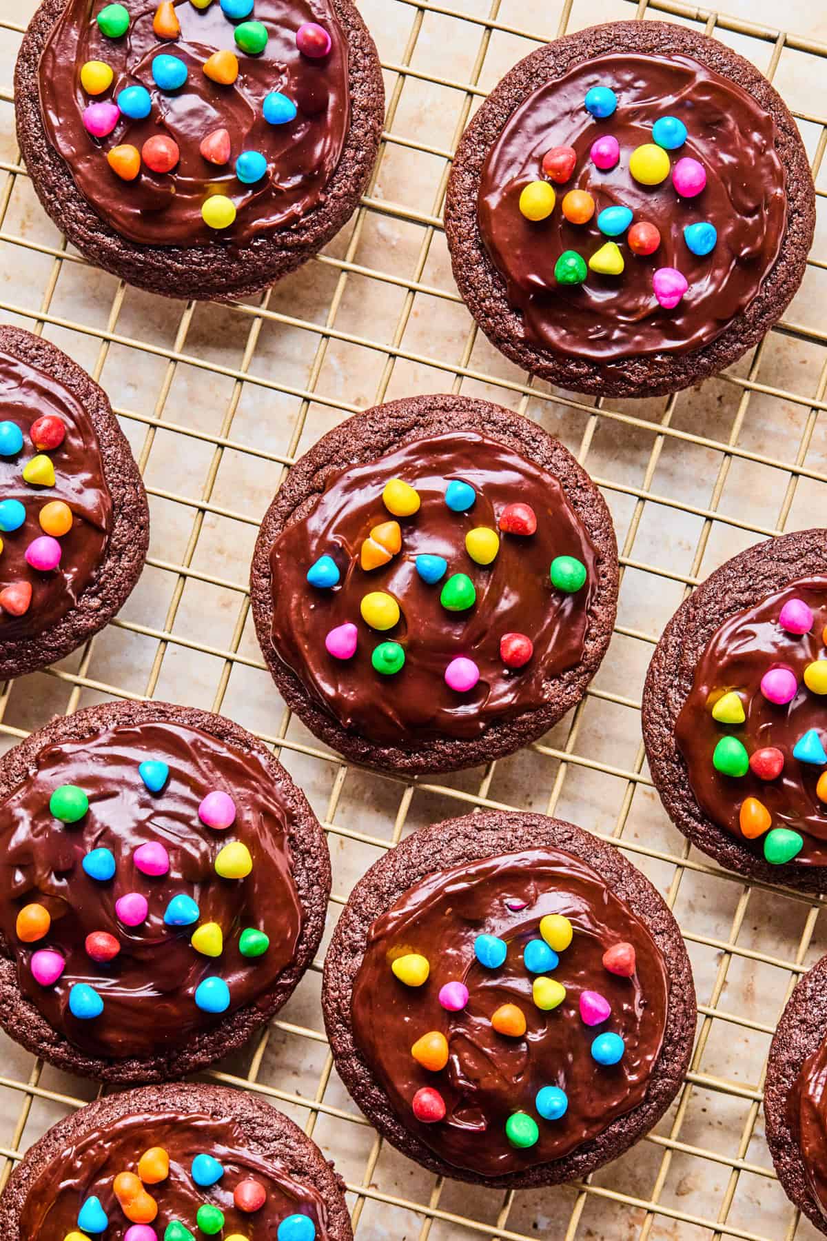 Cosmic brownie chocolate cookies on cooling rack.