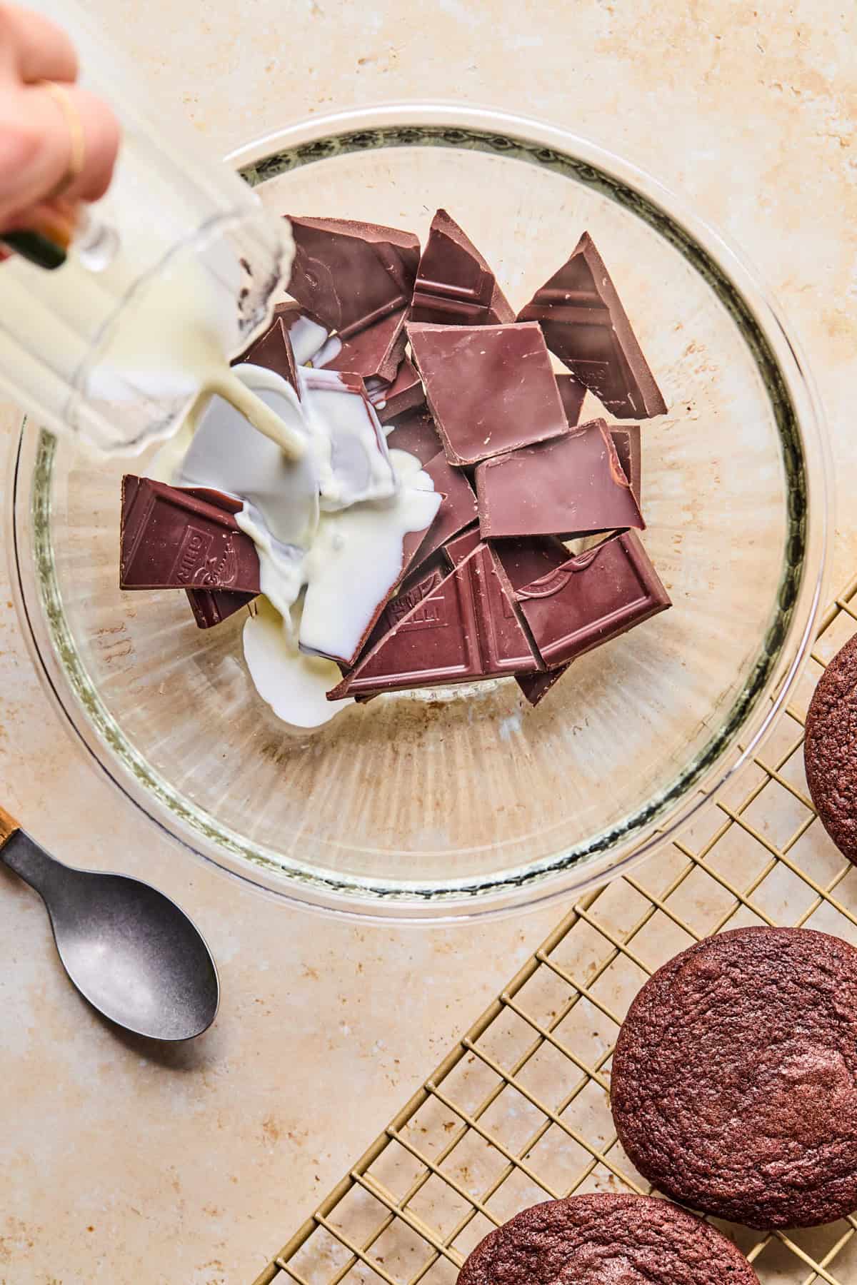 Heavy cream poured onto chopped chocolate.