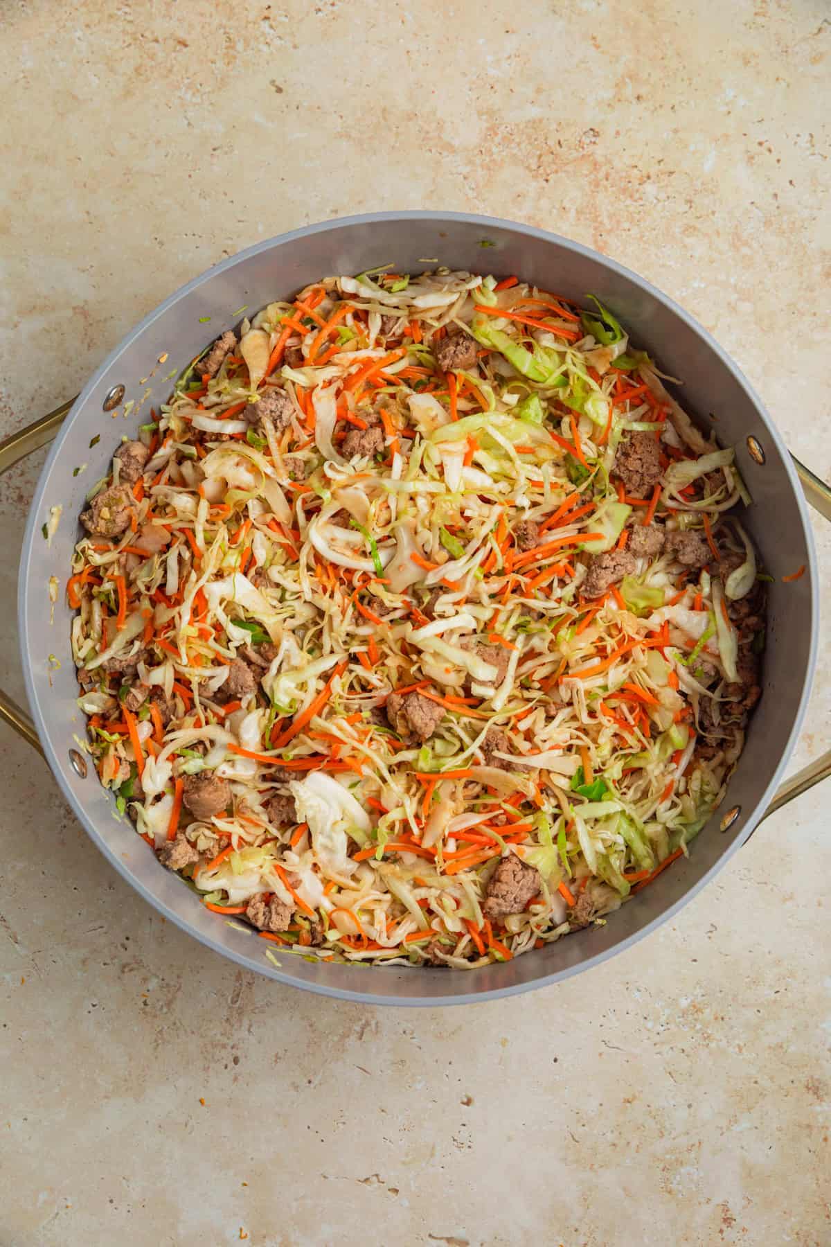 Ground turkey egg roll bowl cooked in pan.