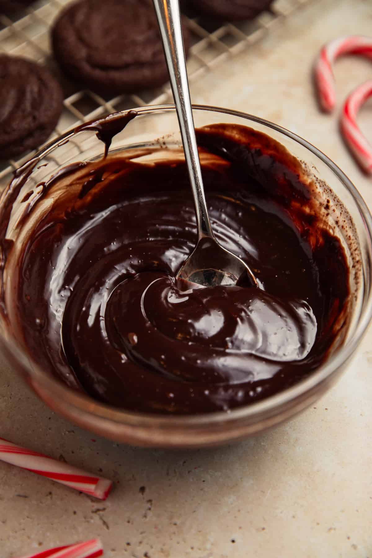Dark chocolate espresso ganache in bowl with spoon.