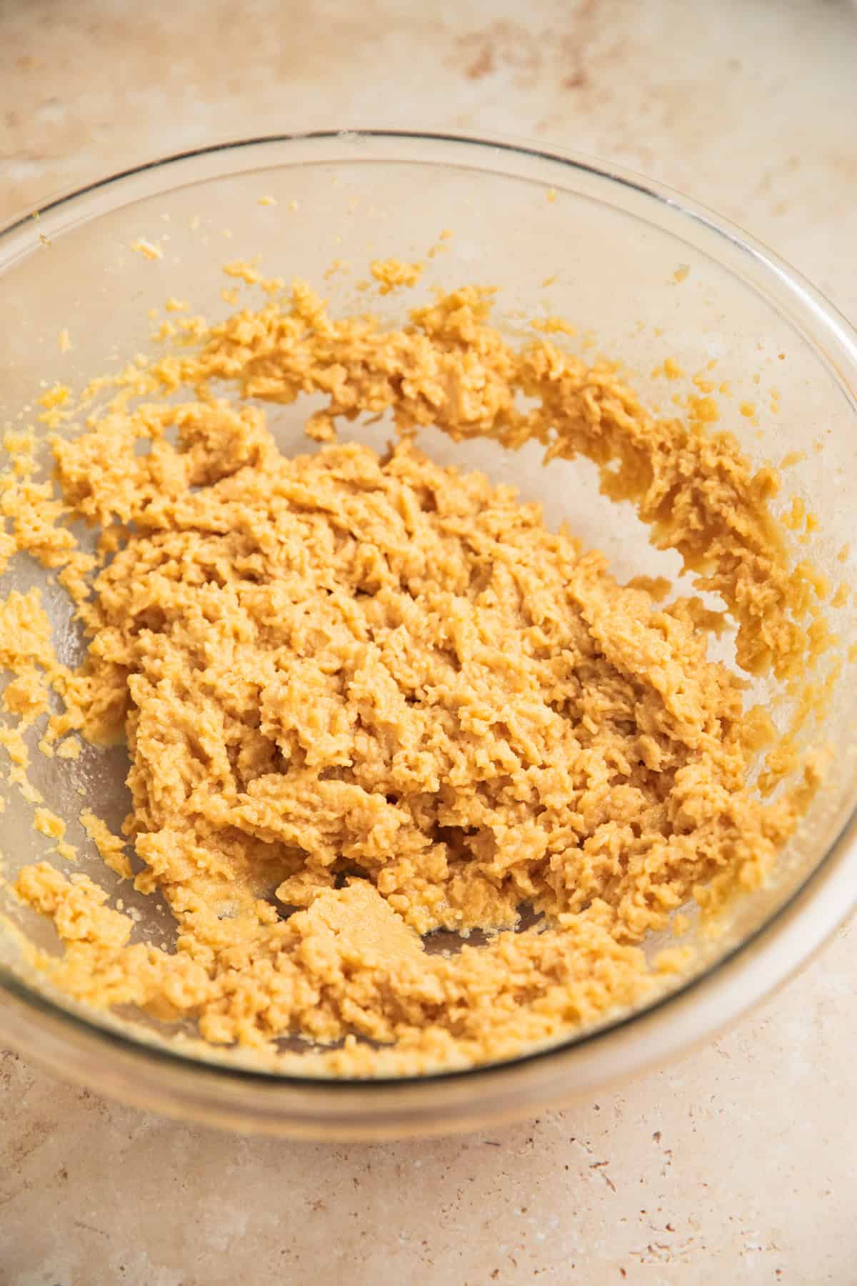 Egg, butter, sugar and peppermint extract combined in bowl.