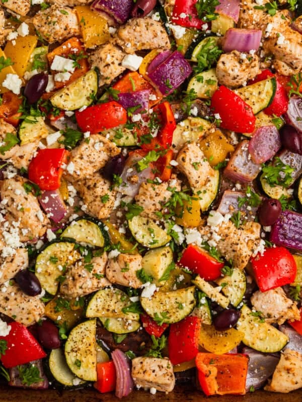 Greek chicken sheet pan dinner with peppers, onions and zucchini.