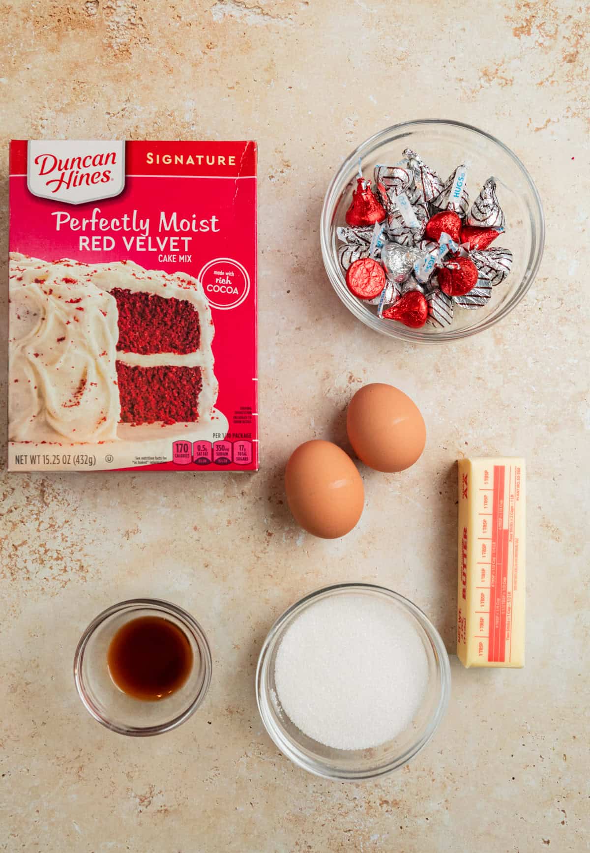 Red velvet cake mix box, Hershey Kisses, eggs, butter and other ingredients.