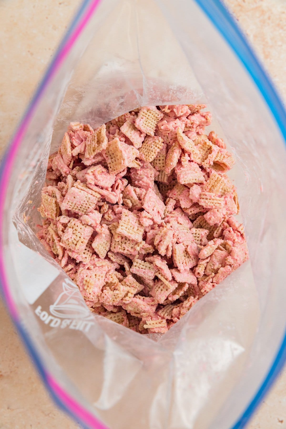 Ziplock bag with strawberry white chocolate coated Chex.