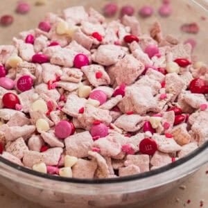Glass bowl with strawberry puppy chow snack.