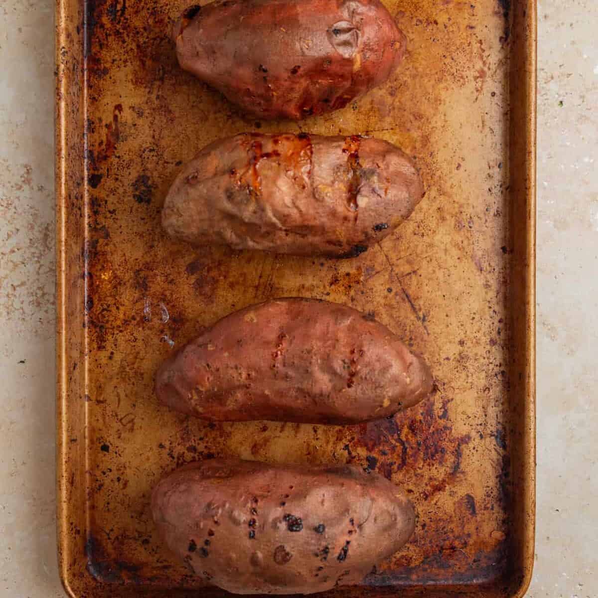 Roasted sweet potatoes on pan.