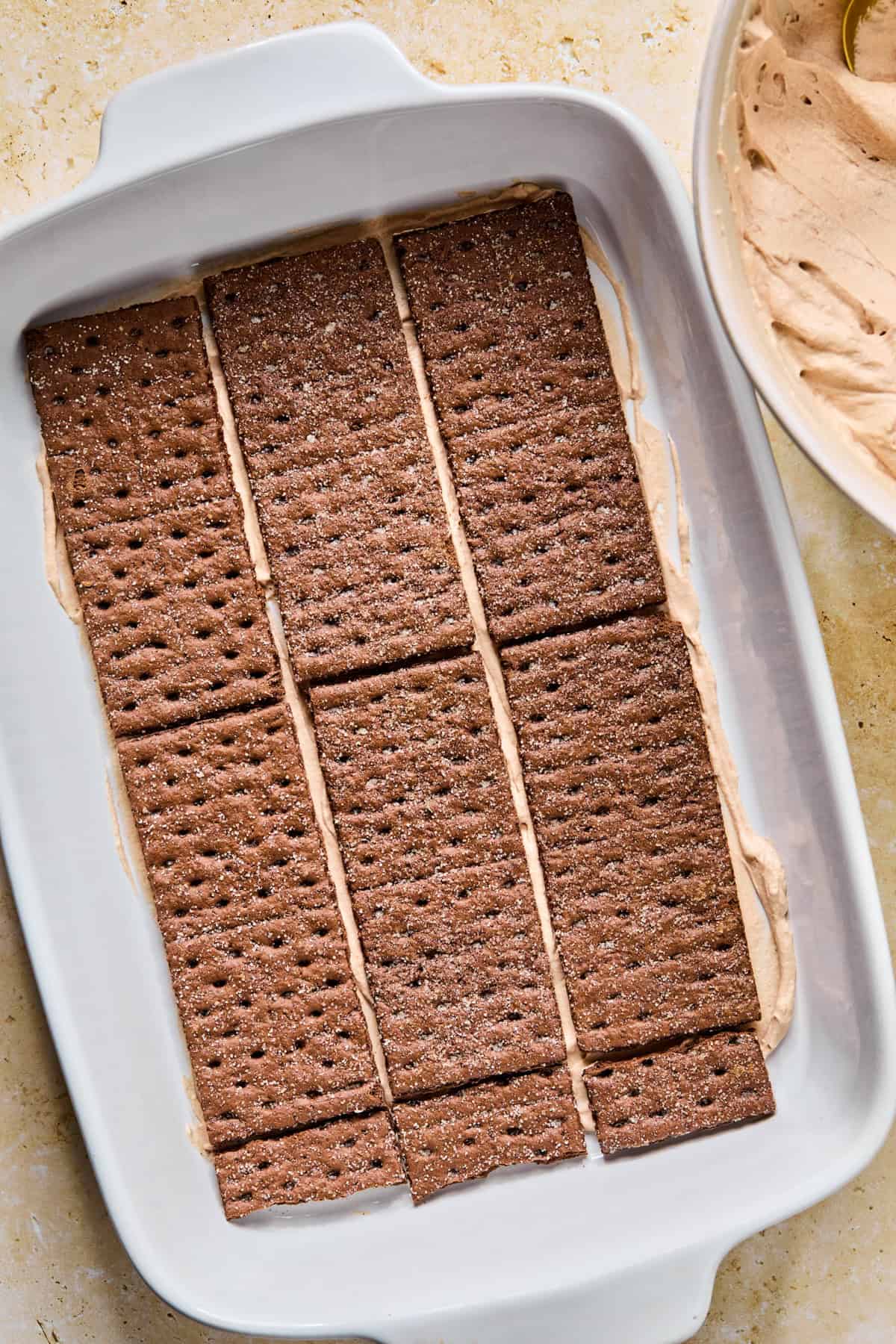 Chocolate graham crackers in a single layer or hot chocolate cream mixture.