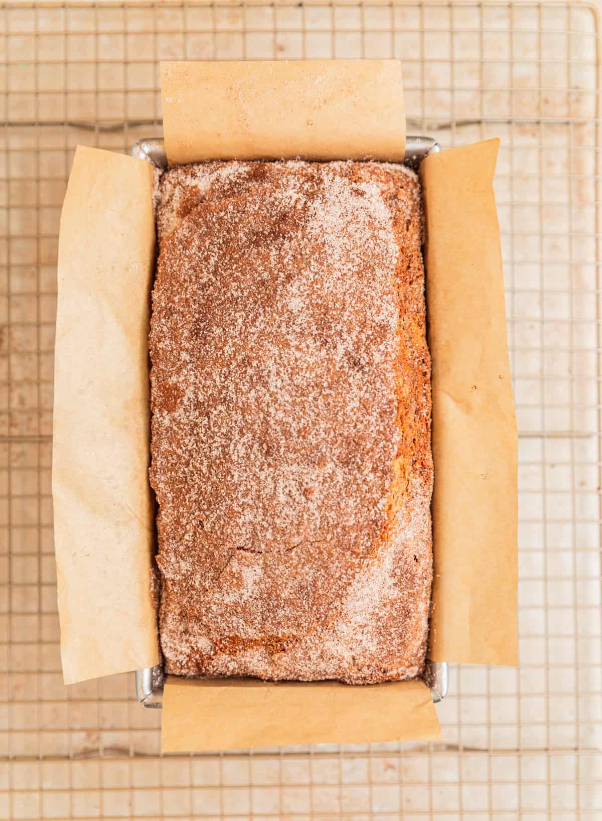 Baked cinnamon banana bread on cooling rack.