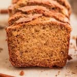 Cinnamon crunch topped banana bread propped up in a row.