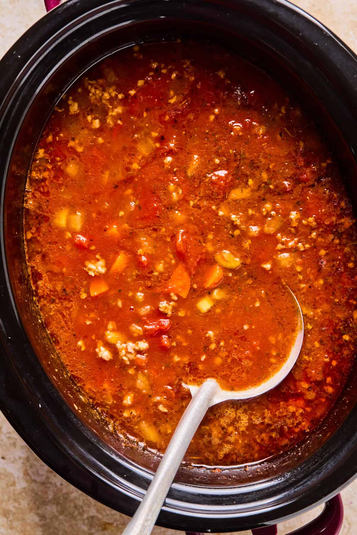 Cooked crockpot Italian sausage soup before adding pasta.