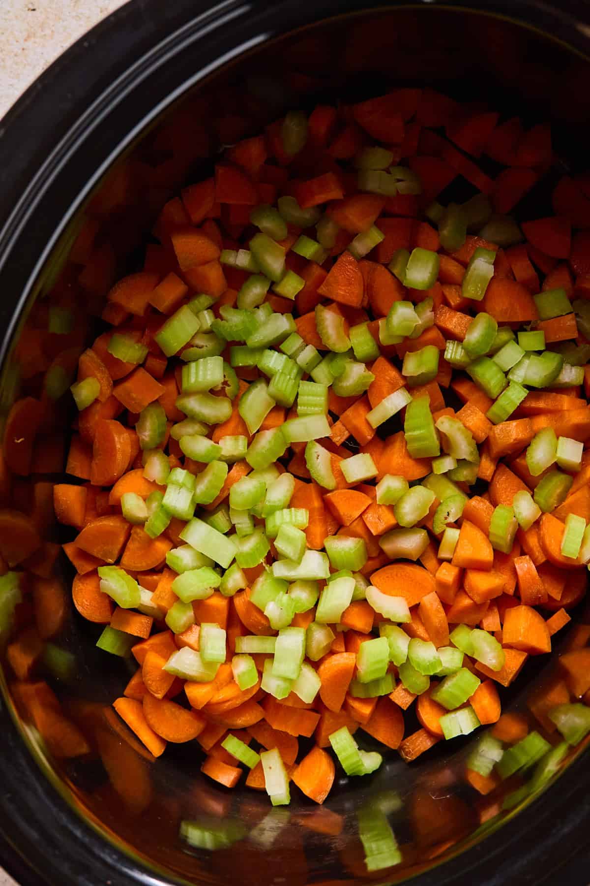 Carrots and celery added to crockpot.