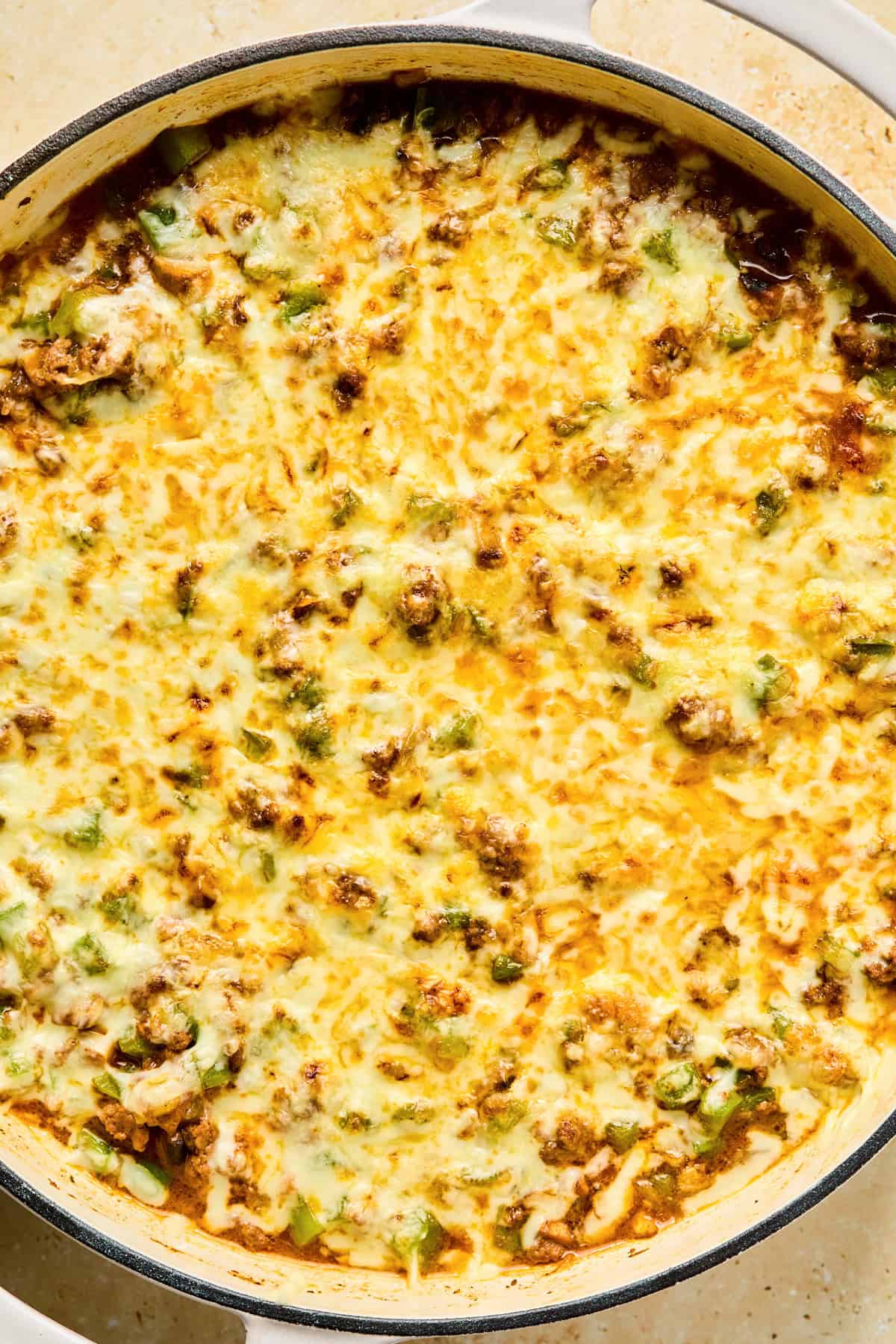 Melted mozzarella cheese over top of Philly Cheesesteak skillet for rice bowls.