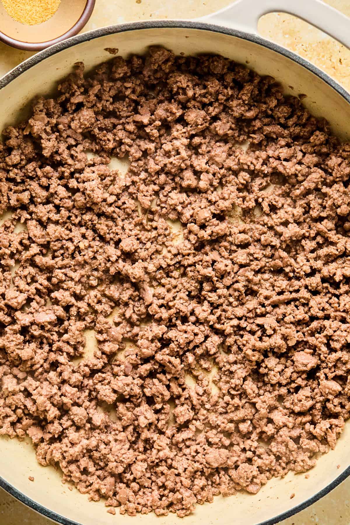 Browned ground beef in skillet.
