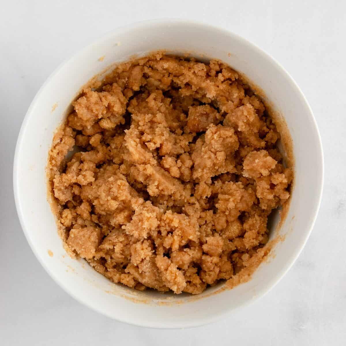 Crumble mixture in white bowl.