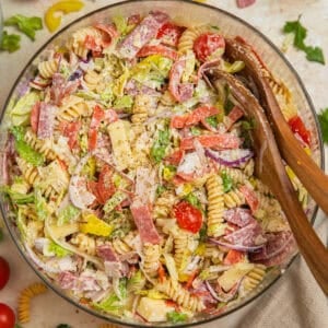 Italian grinder sub pasta salad in glass serving bowl.