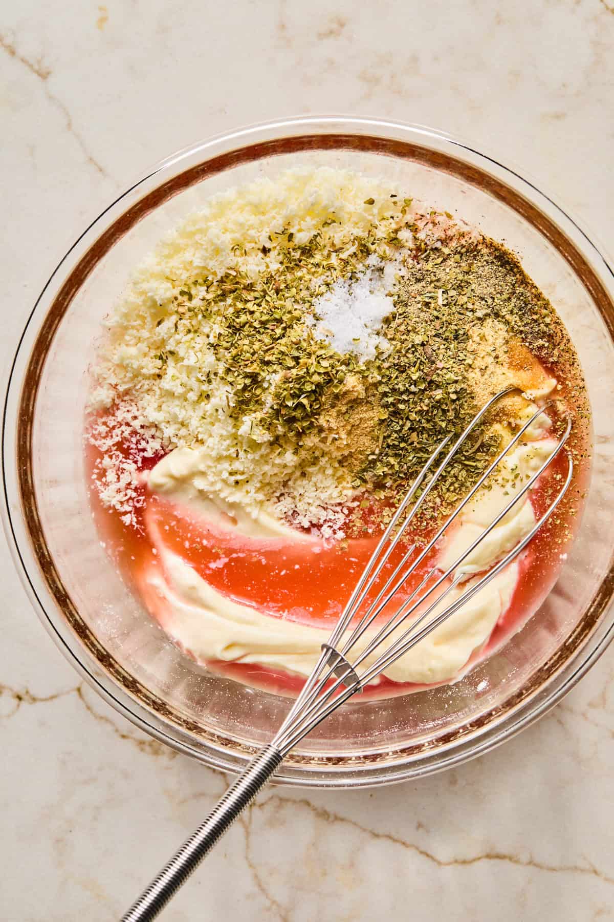Mayonnaise, red wine vinegar, parmesan and seasoning in bowl.